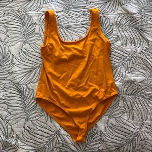 The Laundry Room orange body suit